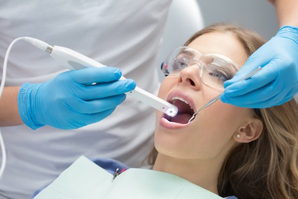 dentist uses intraoral device