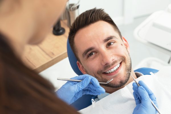 young man gets dental exam